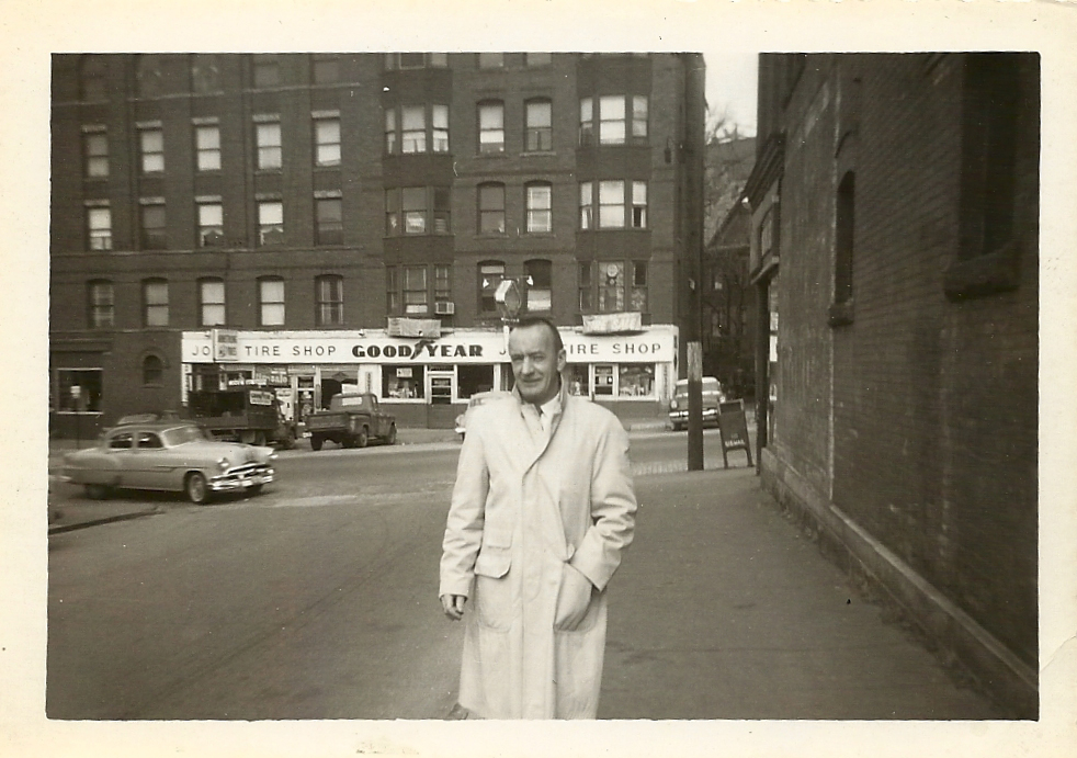 [Man in front of Joe's Tire Shop]